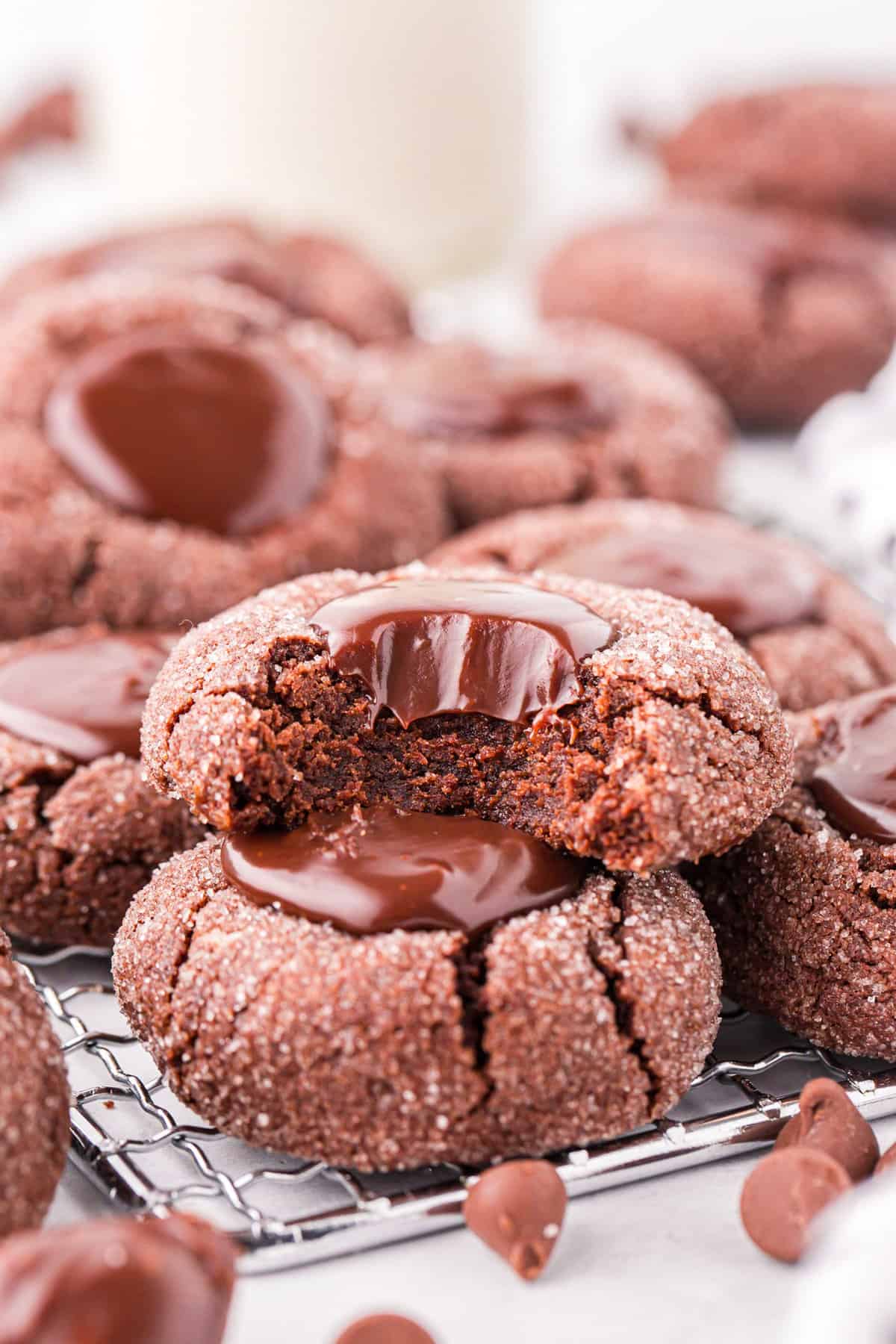 Chocolate Thumbprint Cookies on cooling rack with one bite taken