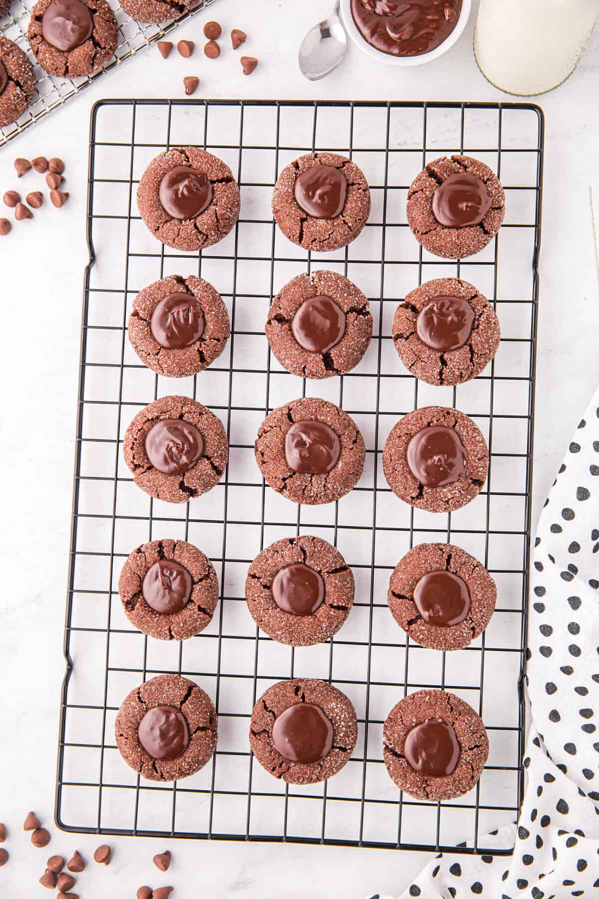 Chocolate Thumbprint Cookies on cooling rack with chocolate ganache setting