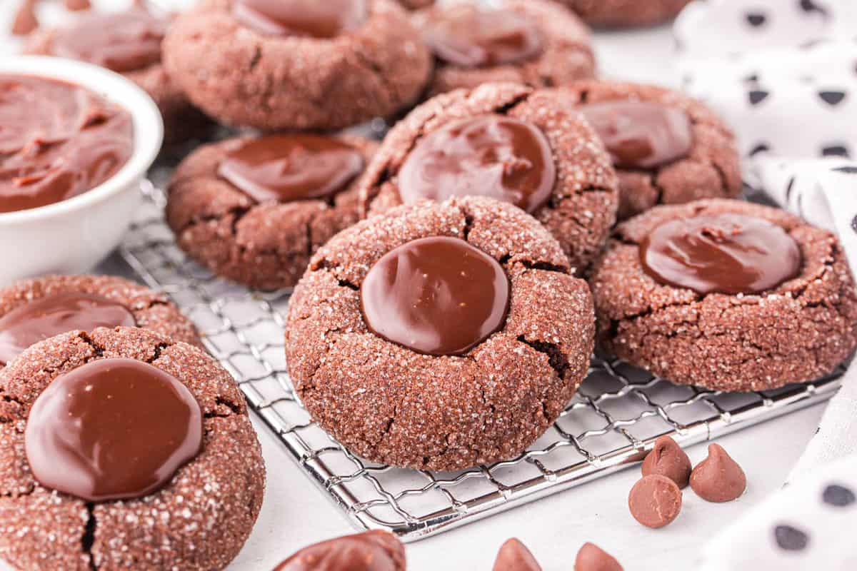 Chocolate Thumbprint Cookies arranged on cooling rack