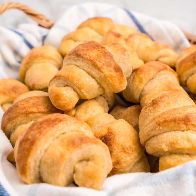 Homemade Crescent Rolls in linen towel lined serving bowl