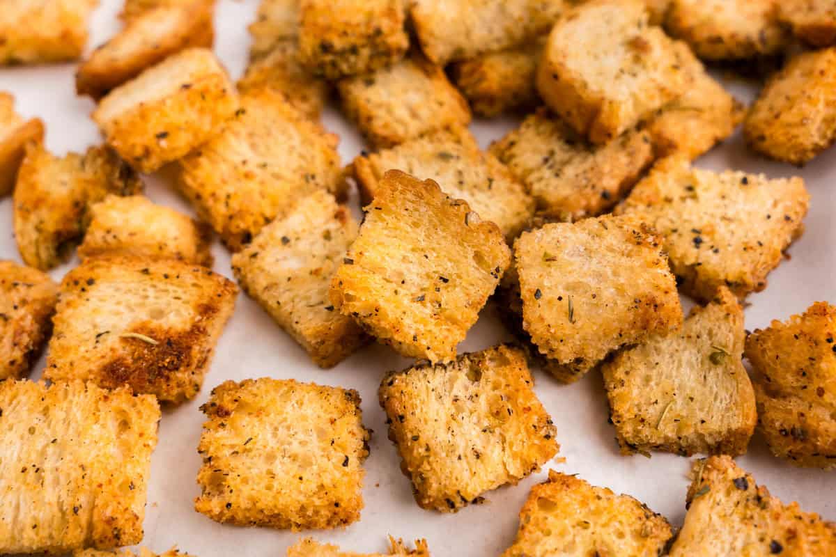 Homemade Croutons on parchment-lined baking sheet