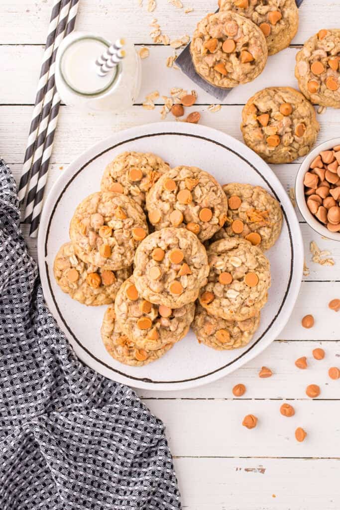 A white plate filled with oatmeal butterscotch cookies.