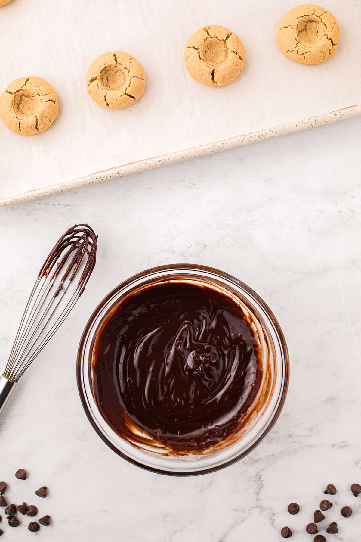 Ganache for the  Peanut Butter Thumbprint Cookies recipe in a small glass bowl
