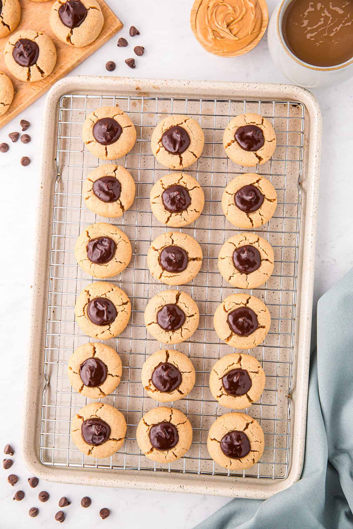 Peanut Butter Thumbprint Cookies on wire cooling rack ready to enjoy