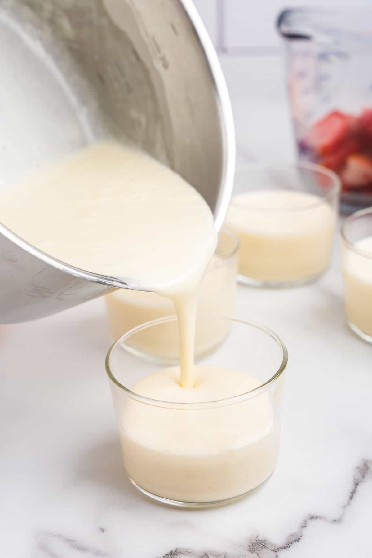 Poring Swedish Creme base into individual serving bup