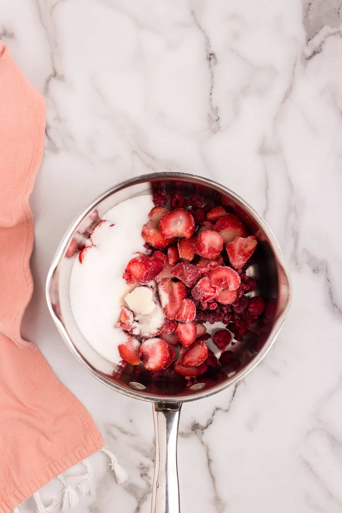Berry compote ingredients in sauce pan for Swedish Creme recipe