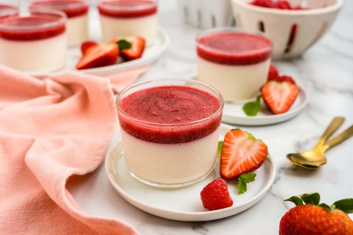 Swedish Creme in dainty serving bowl on plate with sliced strawberries
