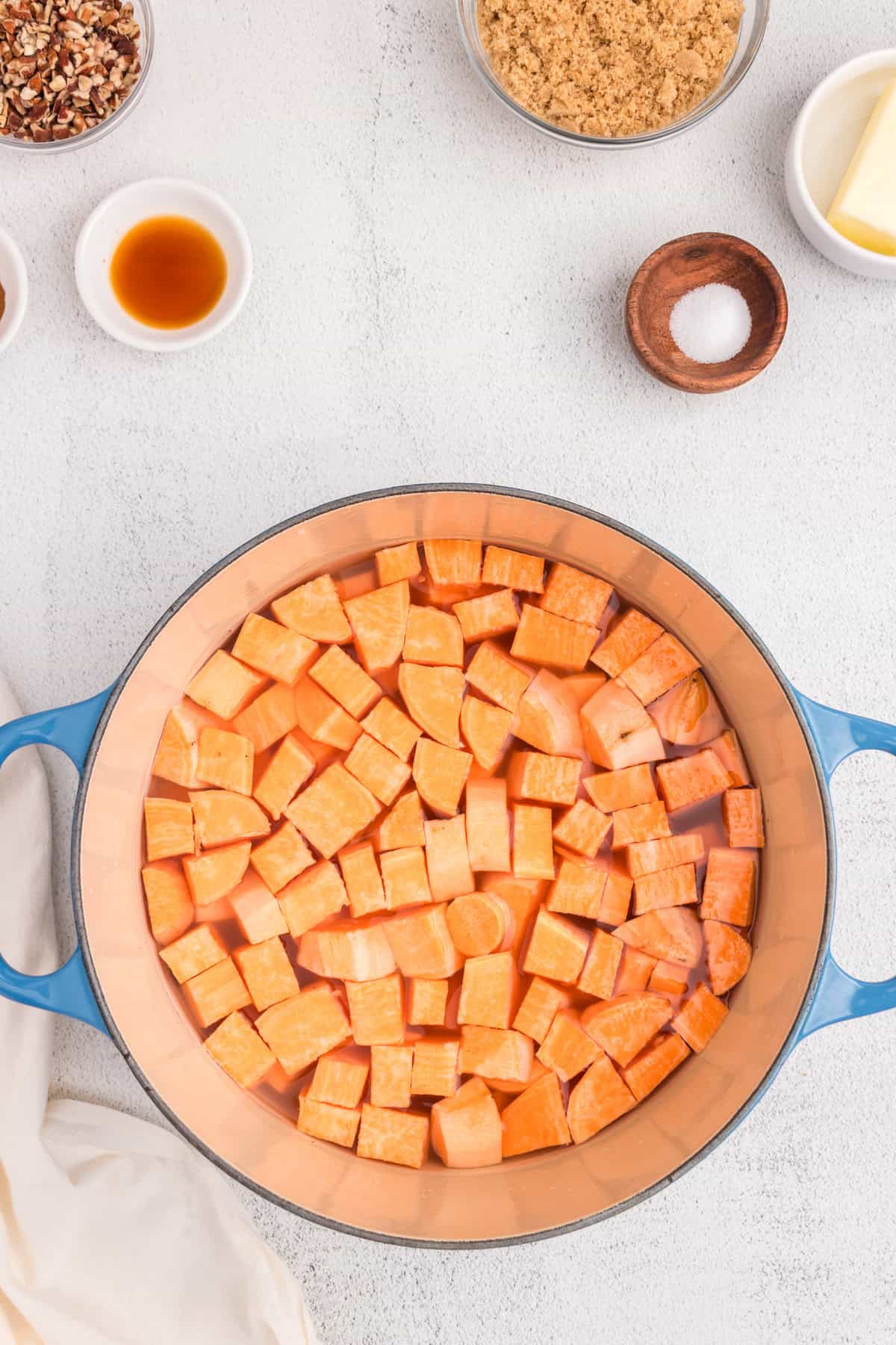 Overhead picture of a pot with diced sweet potatos in it.