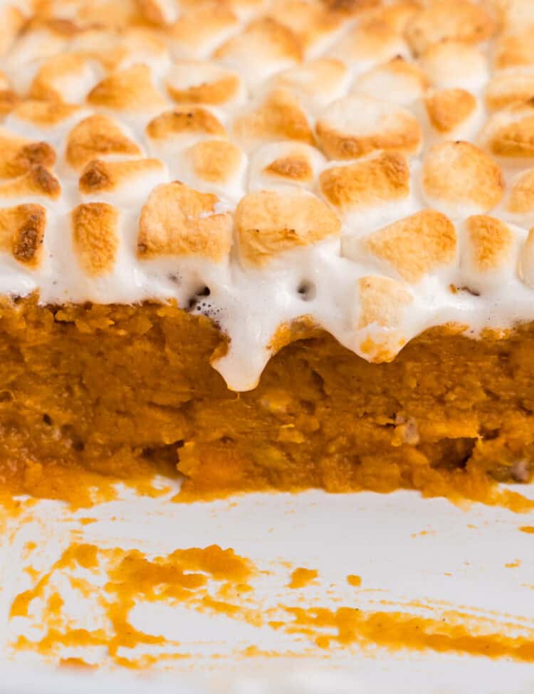 Close up side profile picture of sweet potato casserole layers.