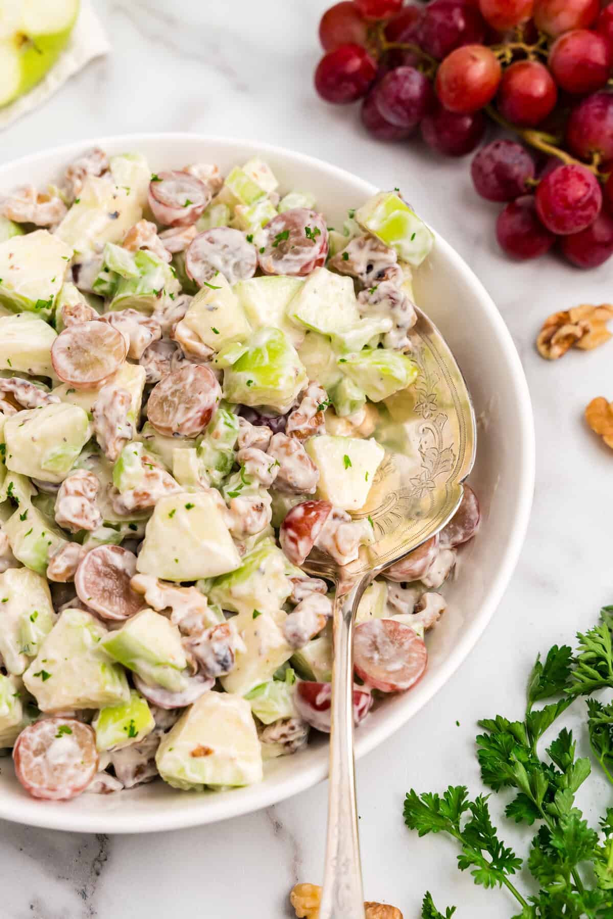 Waldorf Salad in large serving bowl with vintage serving spoon