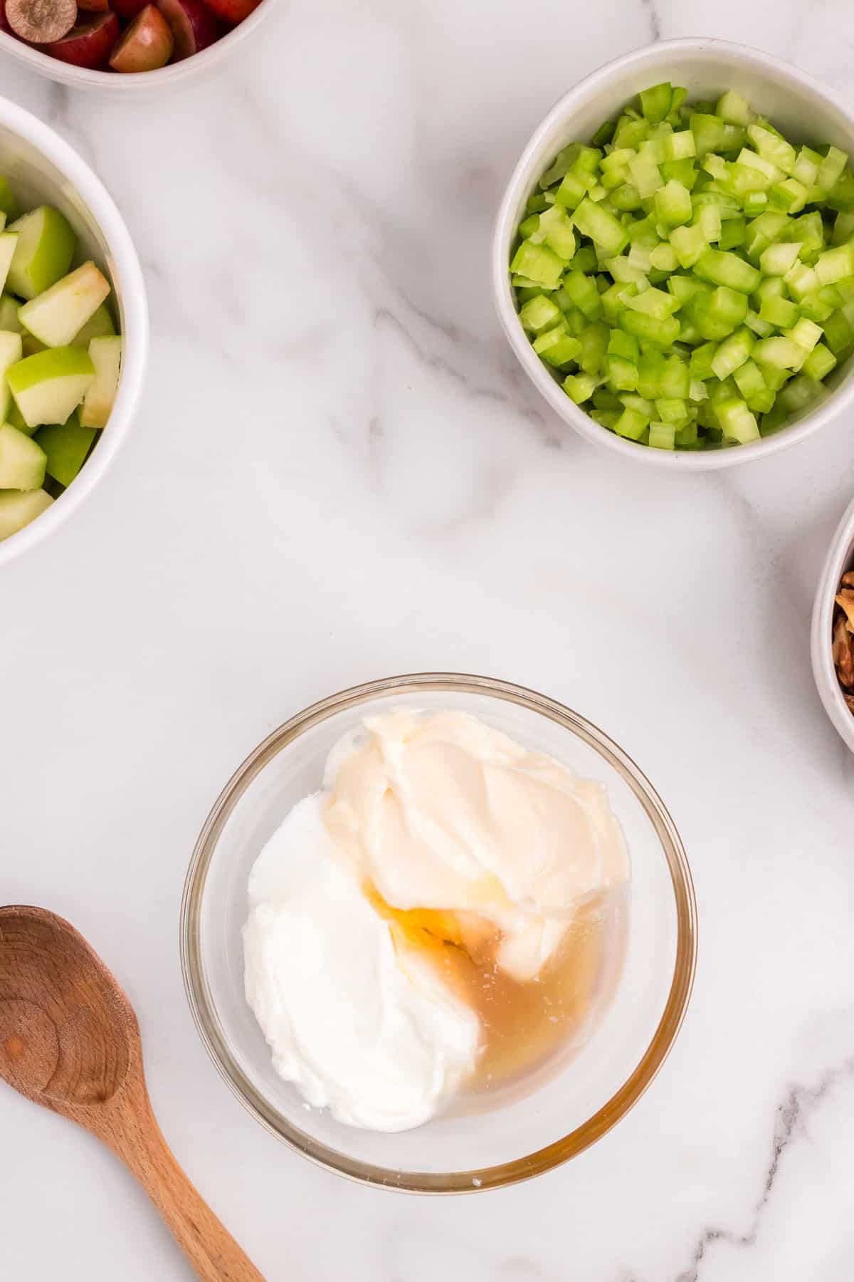 Ingredients for Waldorf Salad dressing in small glass mixing bowl