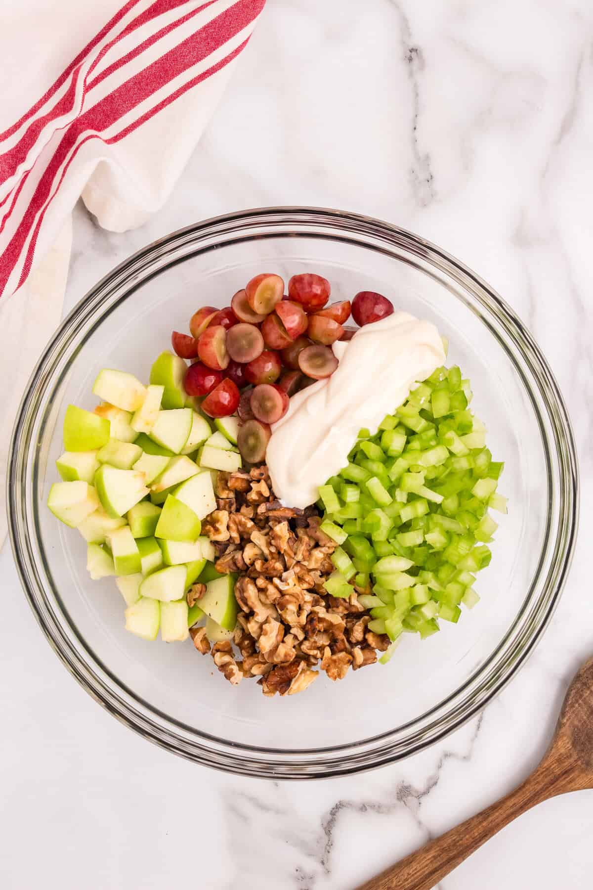 Ingredients for Waldorf Salad in large glass mixing bowl