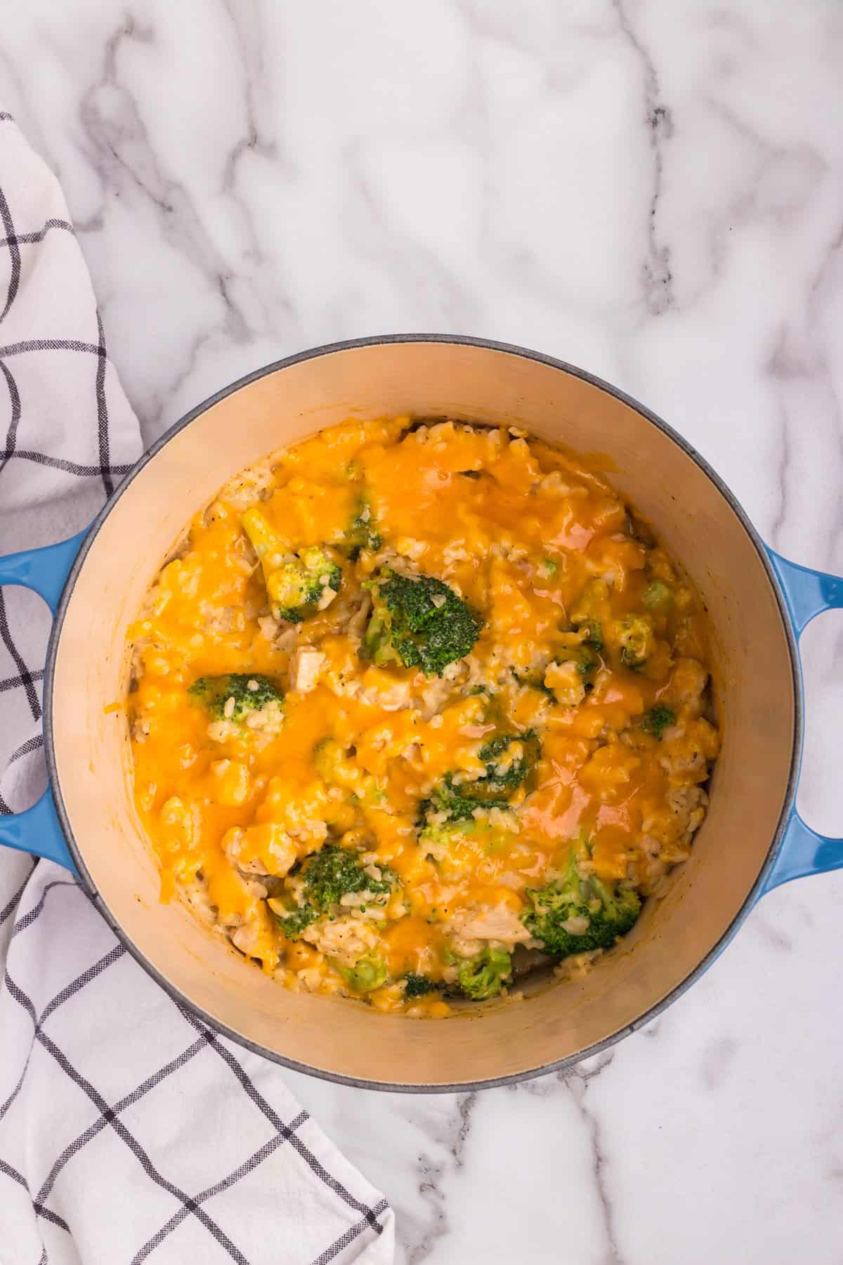 Overhead picture of completed cheesy chicken and broccoli casserole in it.