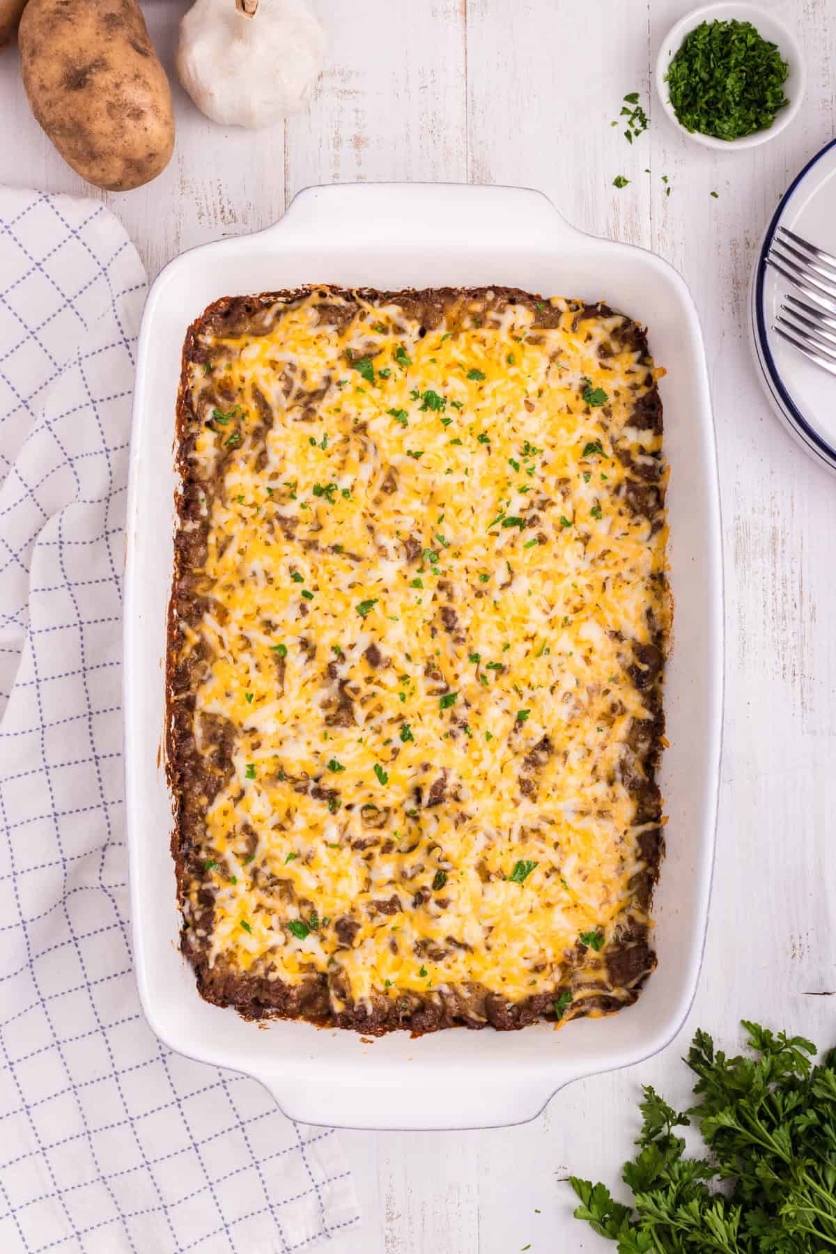Overhead picture of completed ground beef and potato casserole in it.