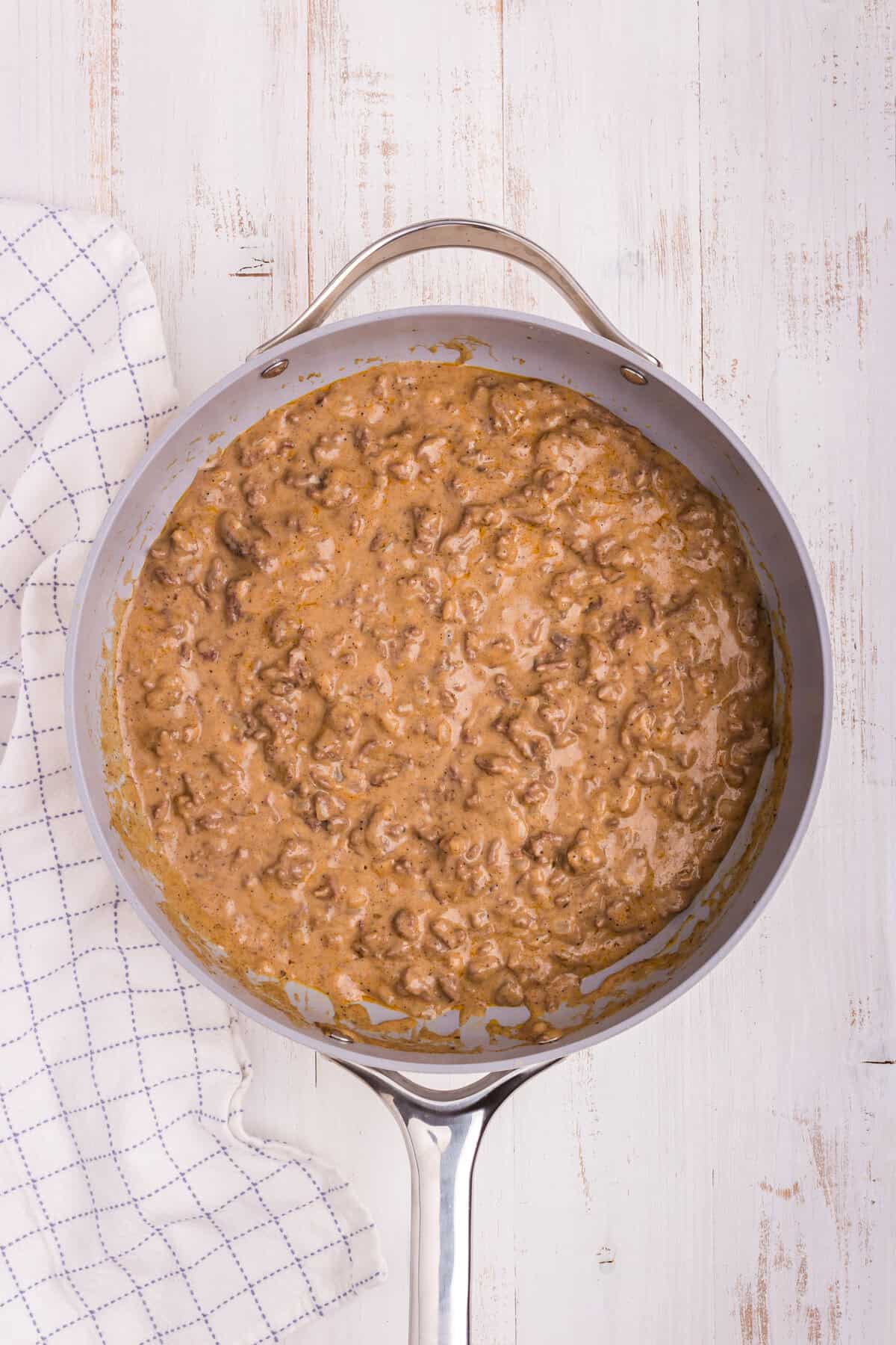 Overhead picture of metal pot with ground beef mixture in it.