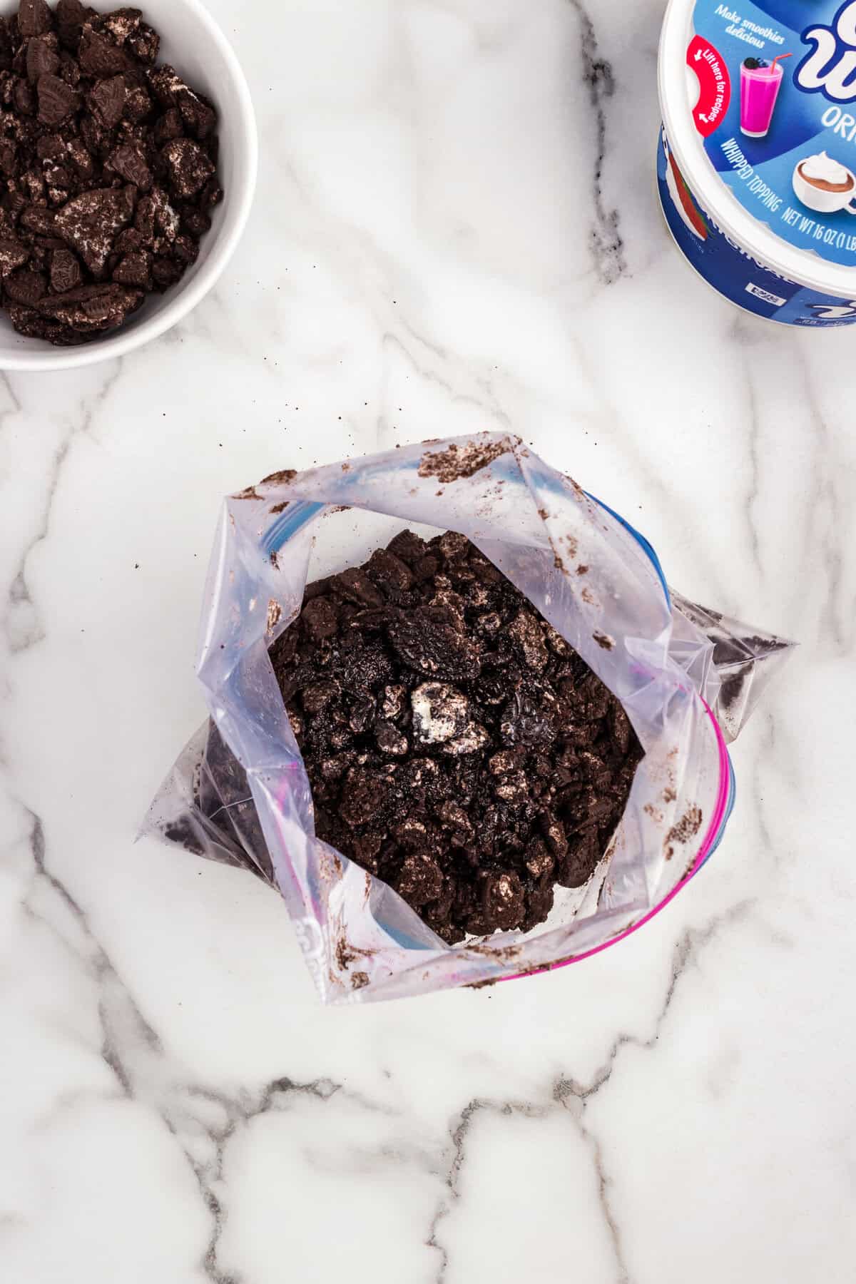 Crushed up Oreos in open ziplock bag