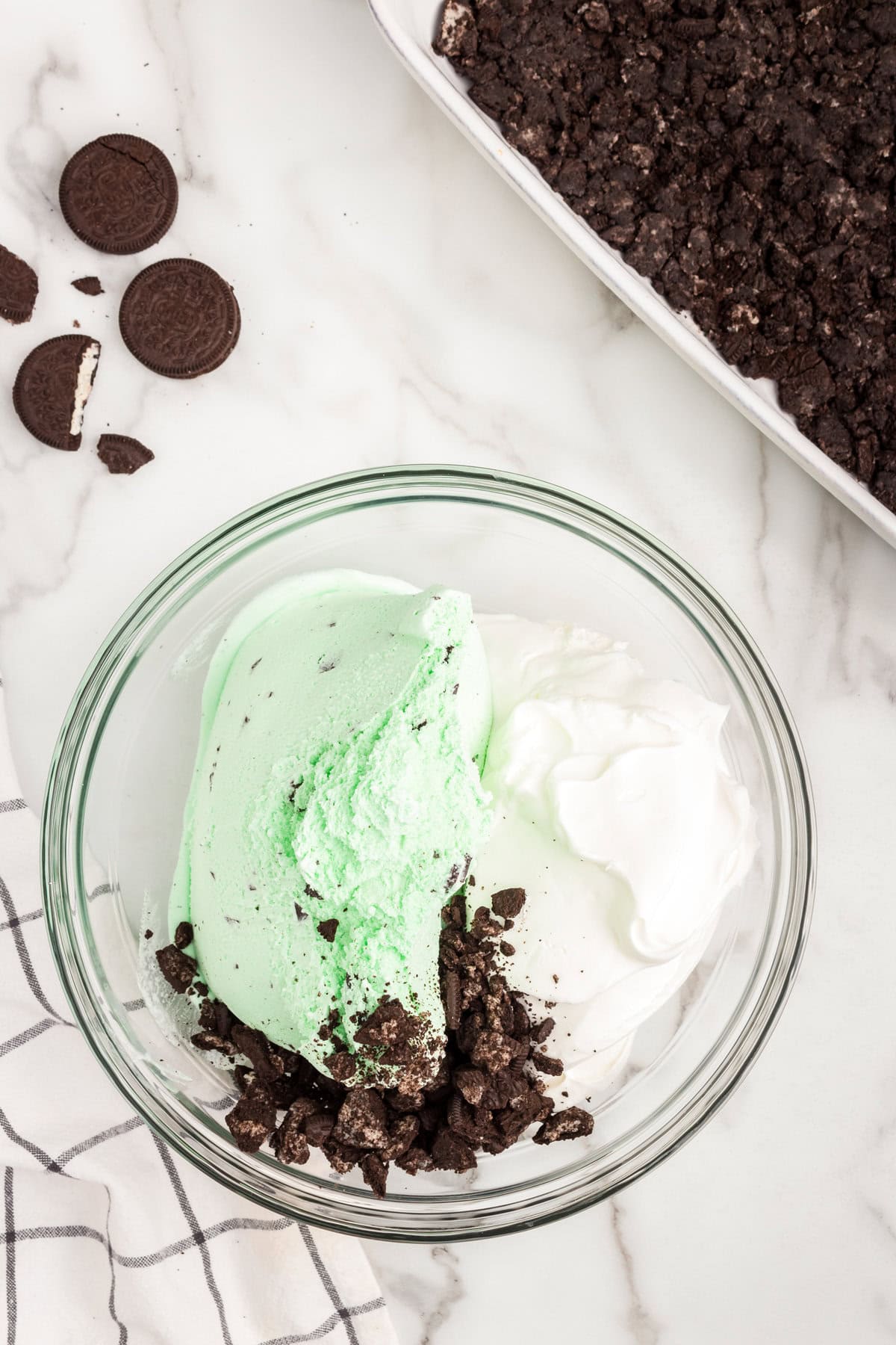 Glass bowl with Mint Ice Cream Dessert ingredients before mixing