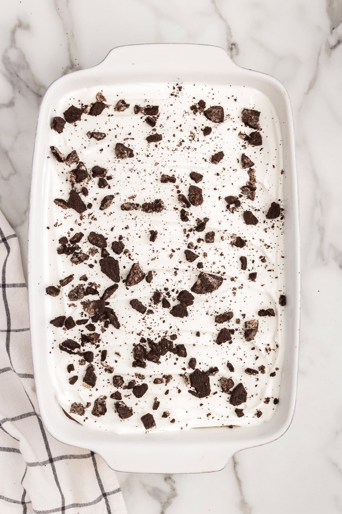 Overhead image of white pan with completed Mint Oreo Ice Cream Dessert in it