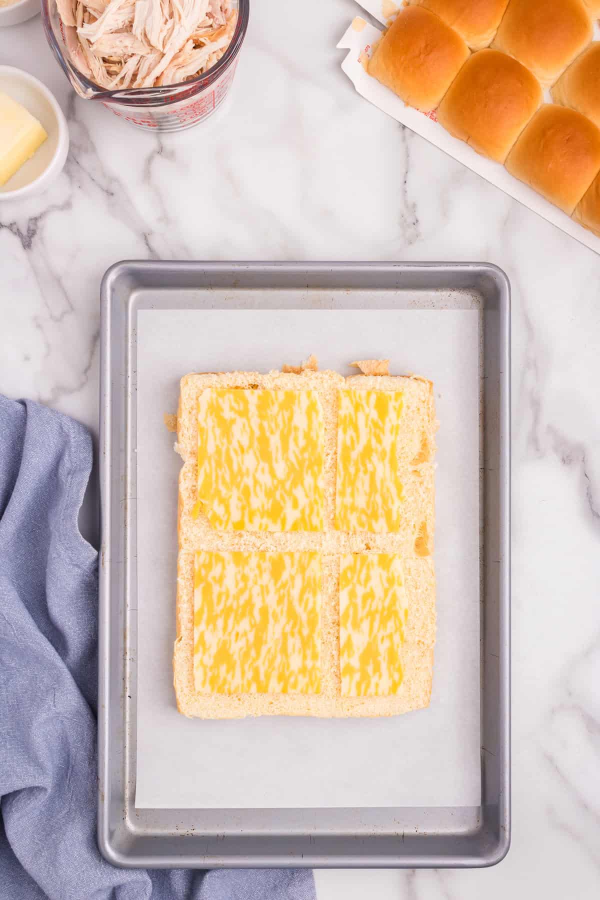 Overhead picture of cheese on hawaiian buns.