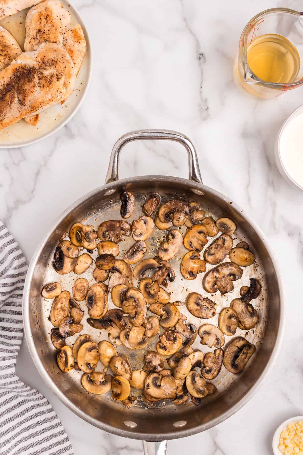 Using stovetop skillet to cook mushrooms for Skillet Cream of Mushroom Chicken recipe