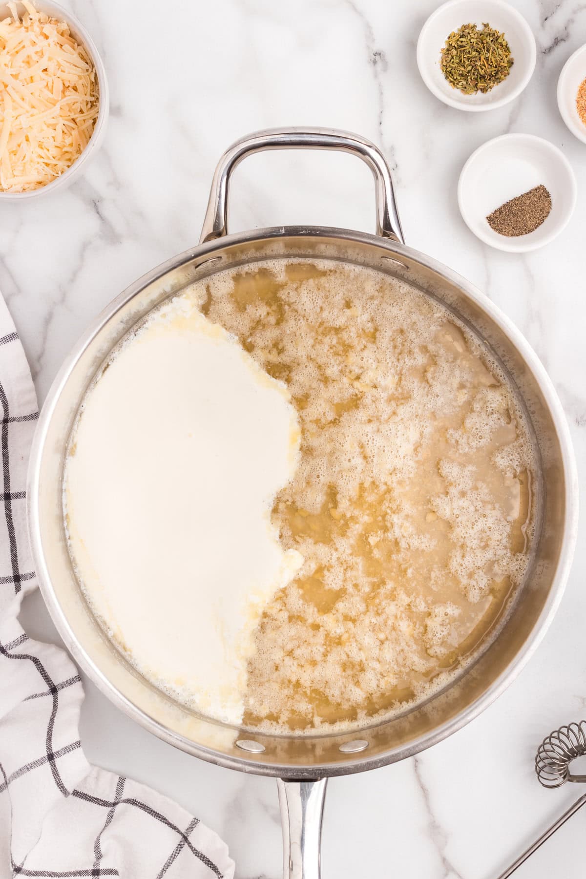 Metal pot with broth and heavy cream not combined