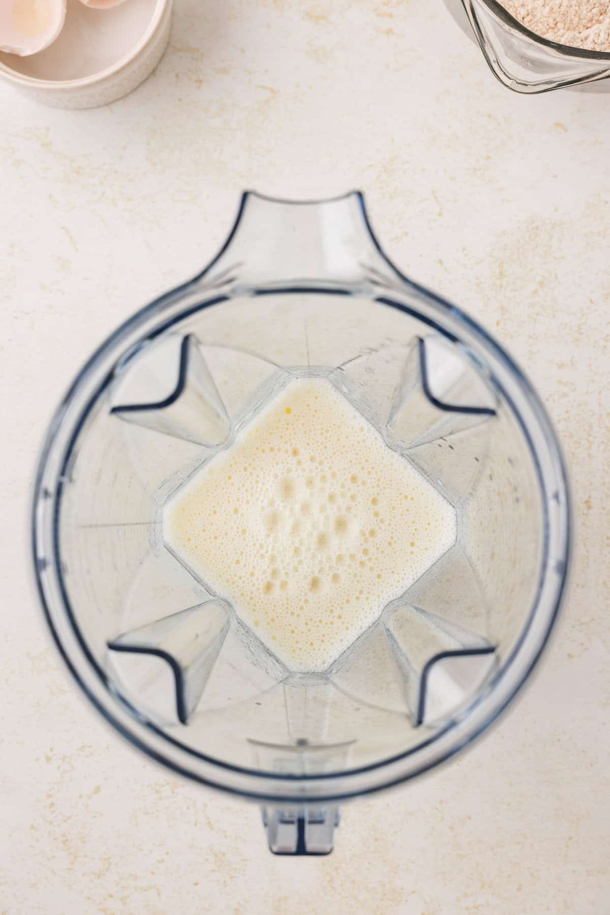 Blender with wet ingredients in it.