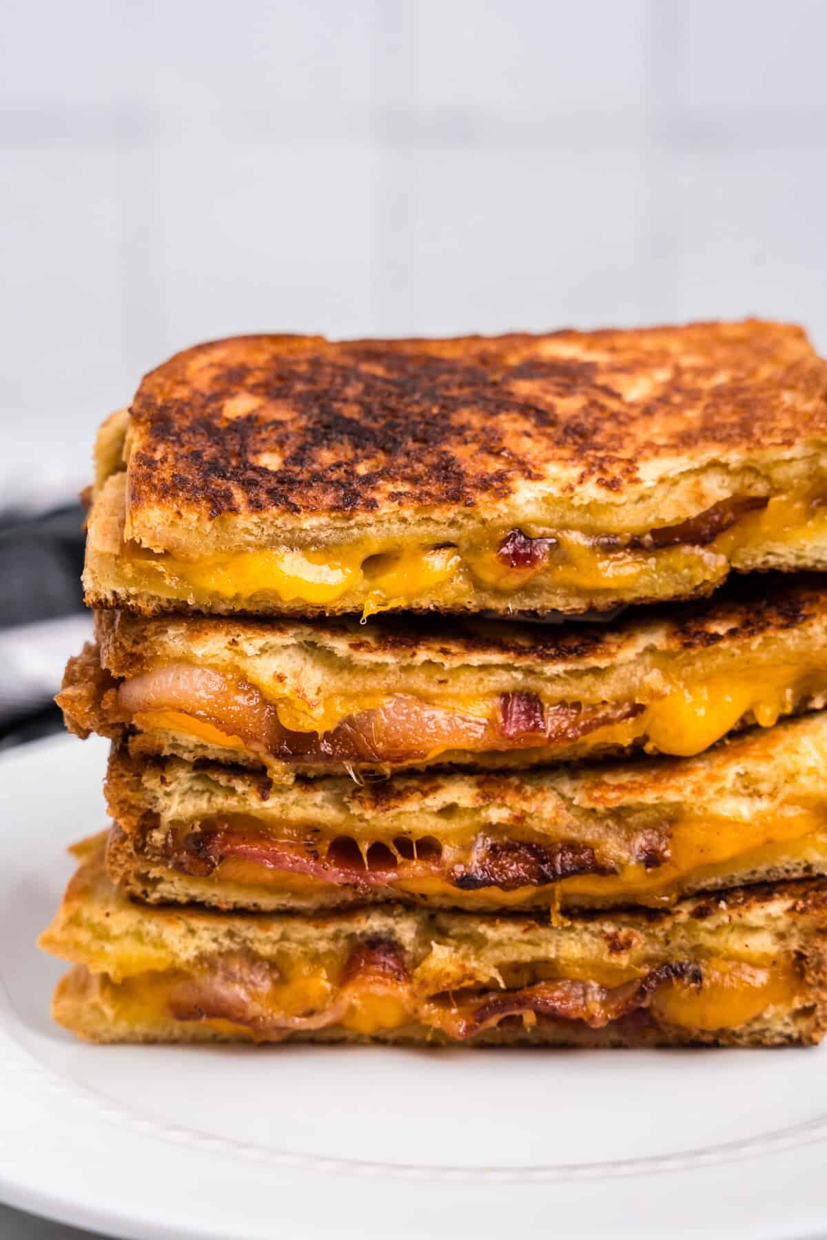 Bacon Grilled Cheese cut in half and stacked