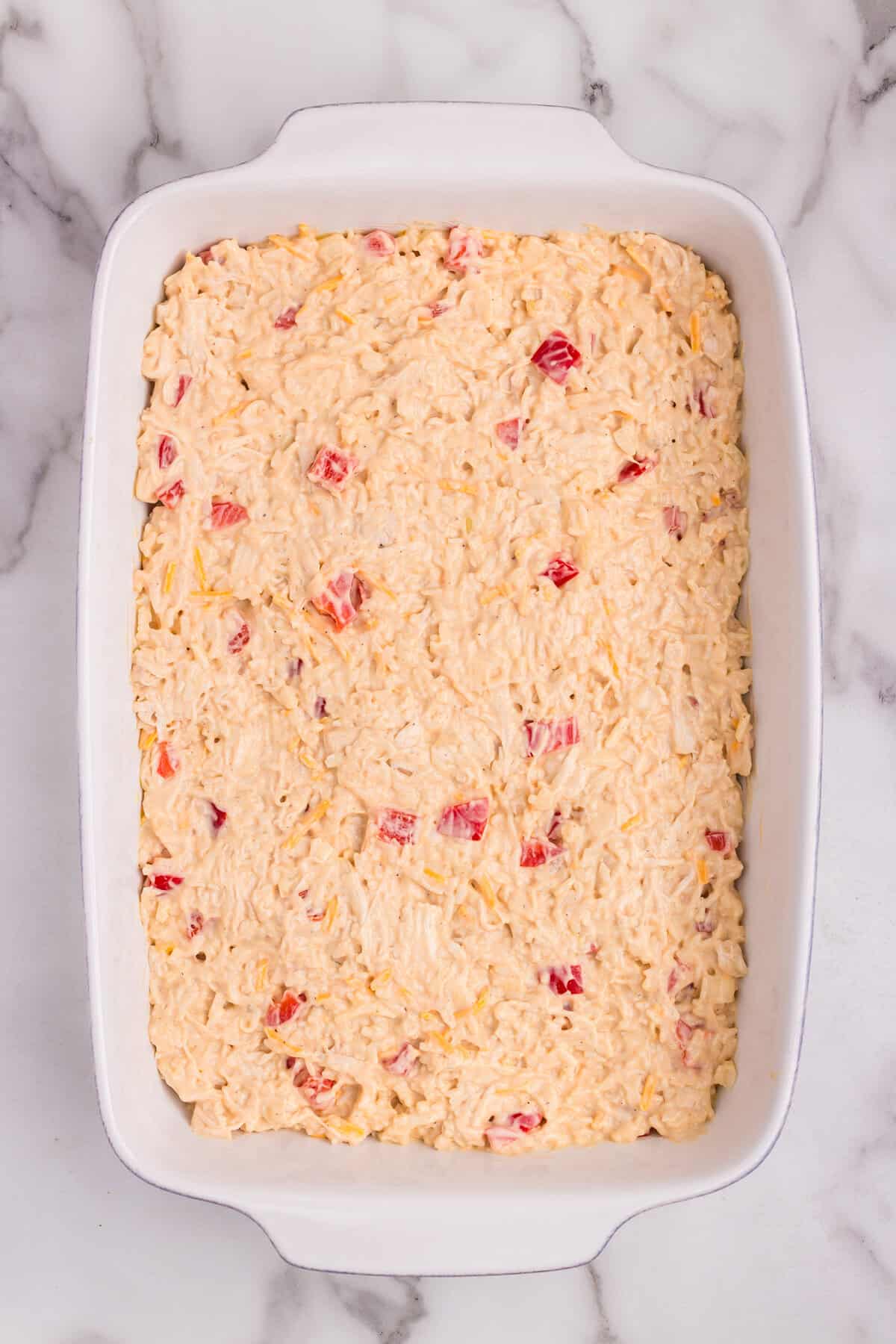 Overhead picture of casserole mixture in a white baking pan.