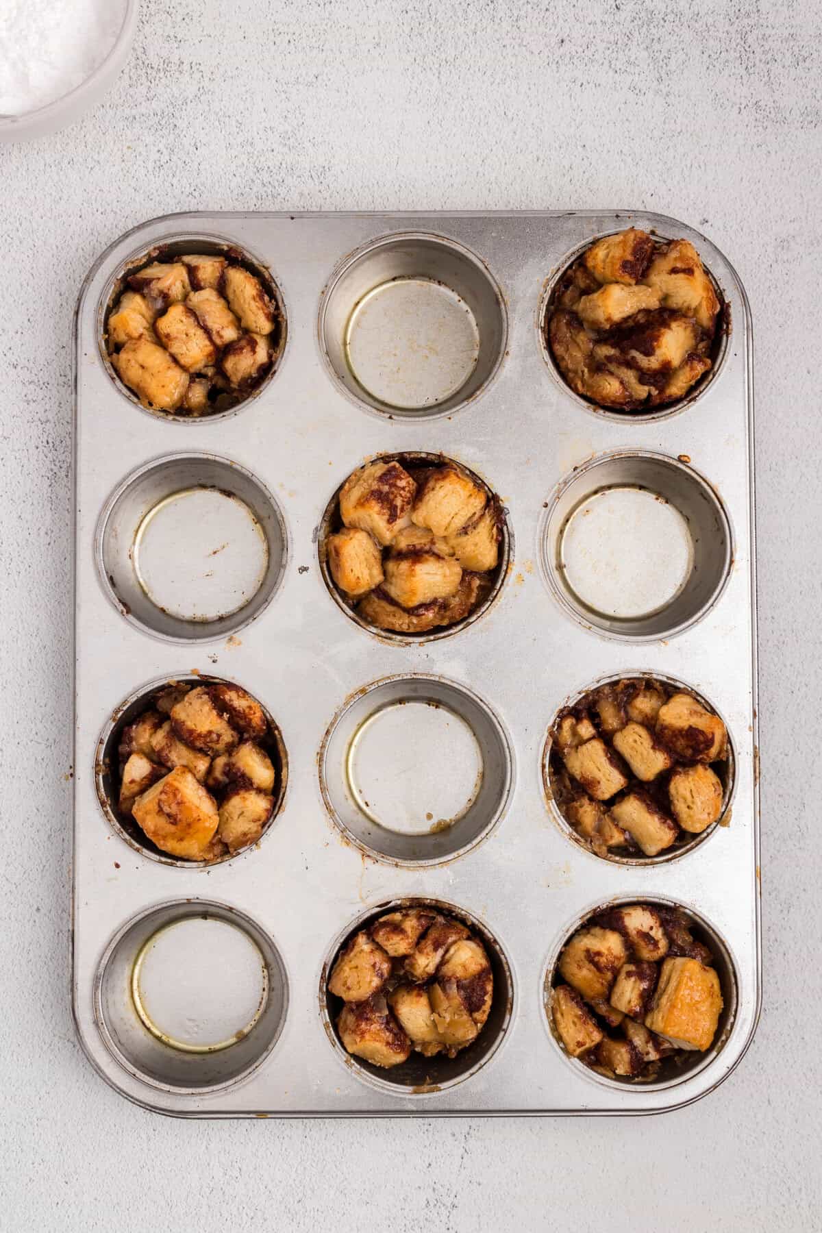 Overhead picture of cinnamon roll monkey bread muffins cooked.