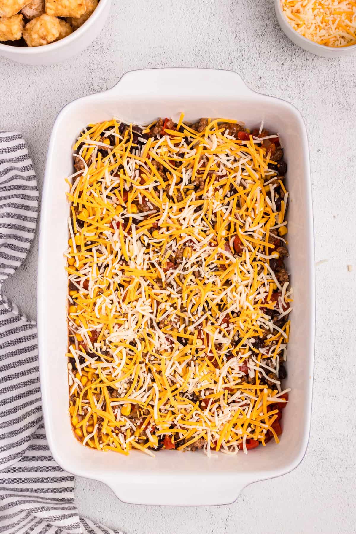 Overhead picture of casserole with cheese sprinkled on top.