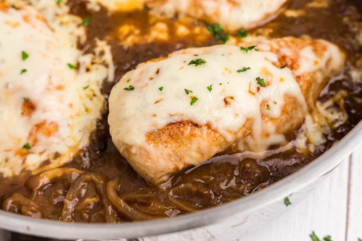 Close up picture of completed French Onion Chicken in a pan.