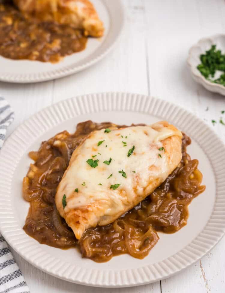 Overhead picture of completed French Onion Chicken on a white plate.