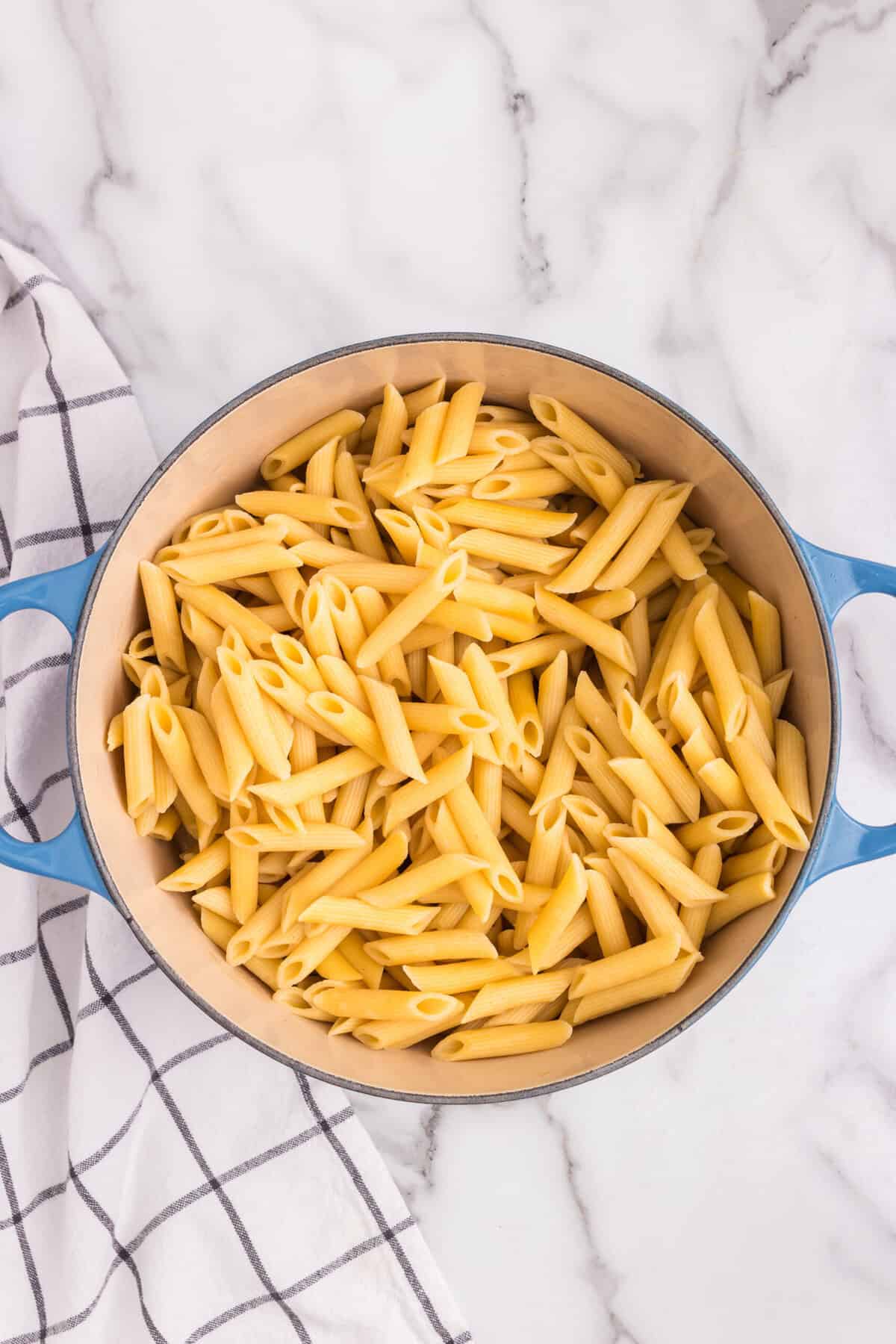 Overhead picture of cooked pasta in a pot.