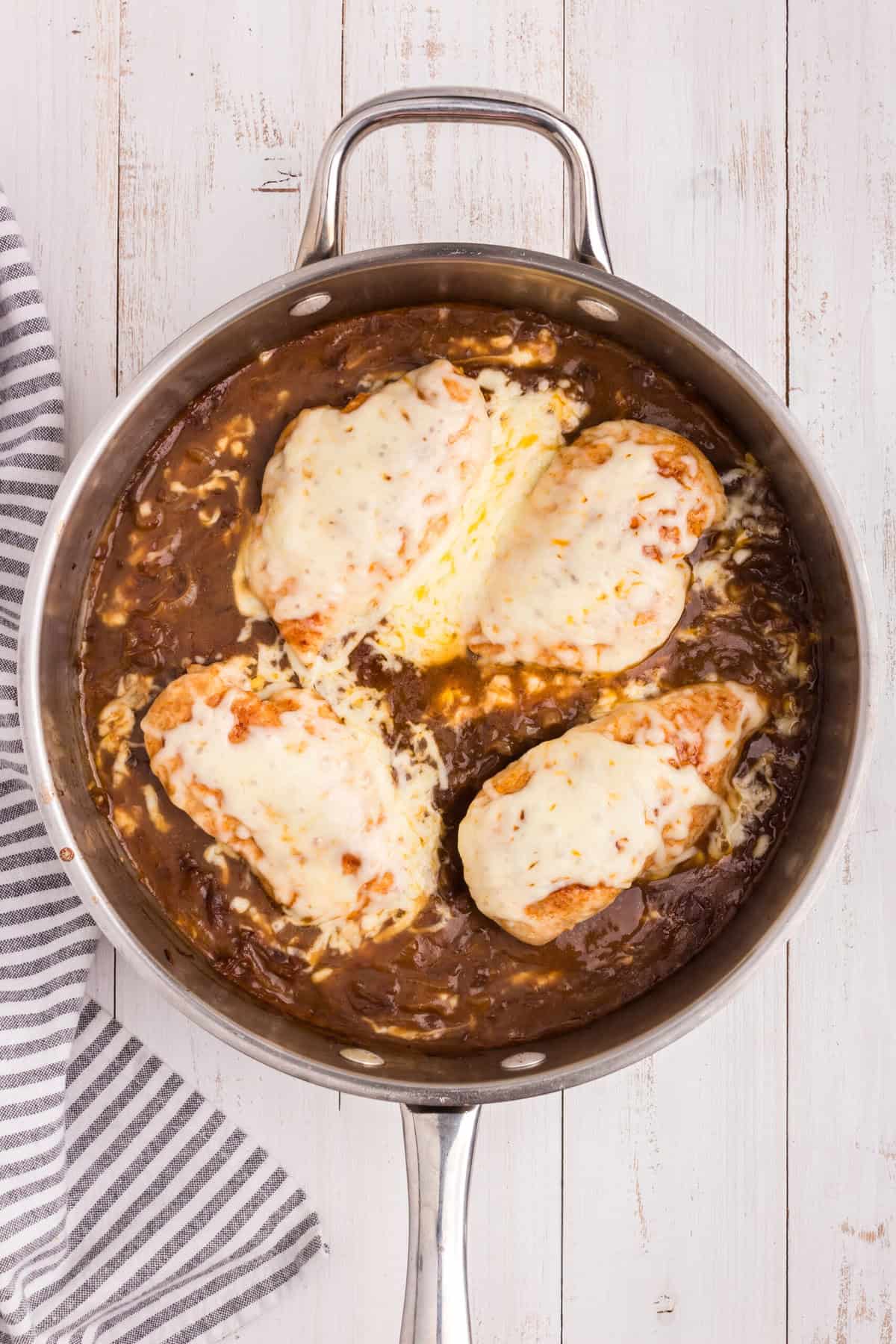 Overhead picture of french onion chicken with mozzarella cheese on top melted.
