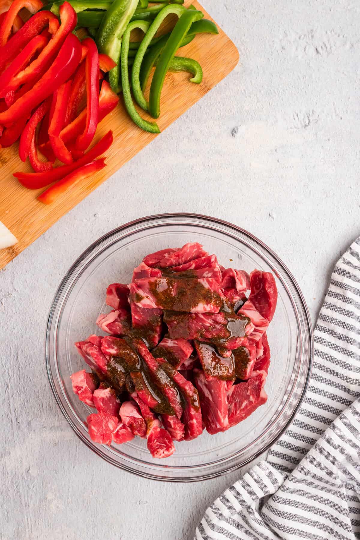 Overhead picture of raw steak with marinate poured over it.