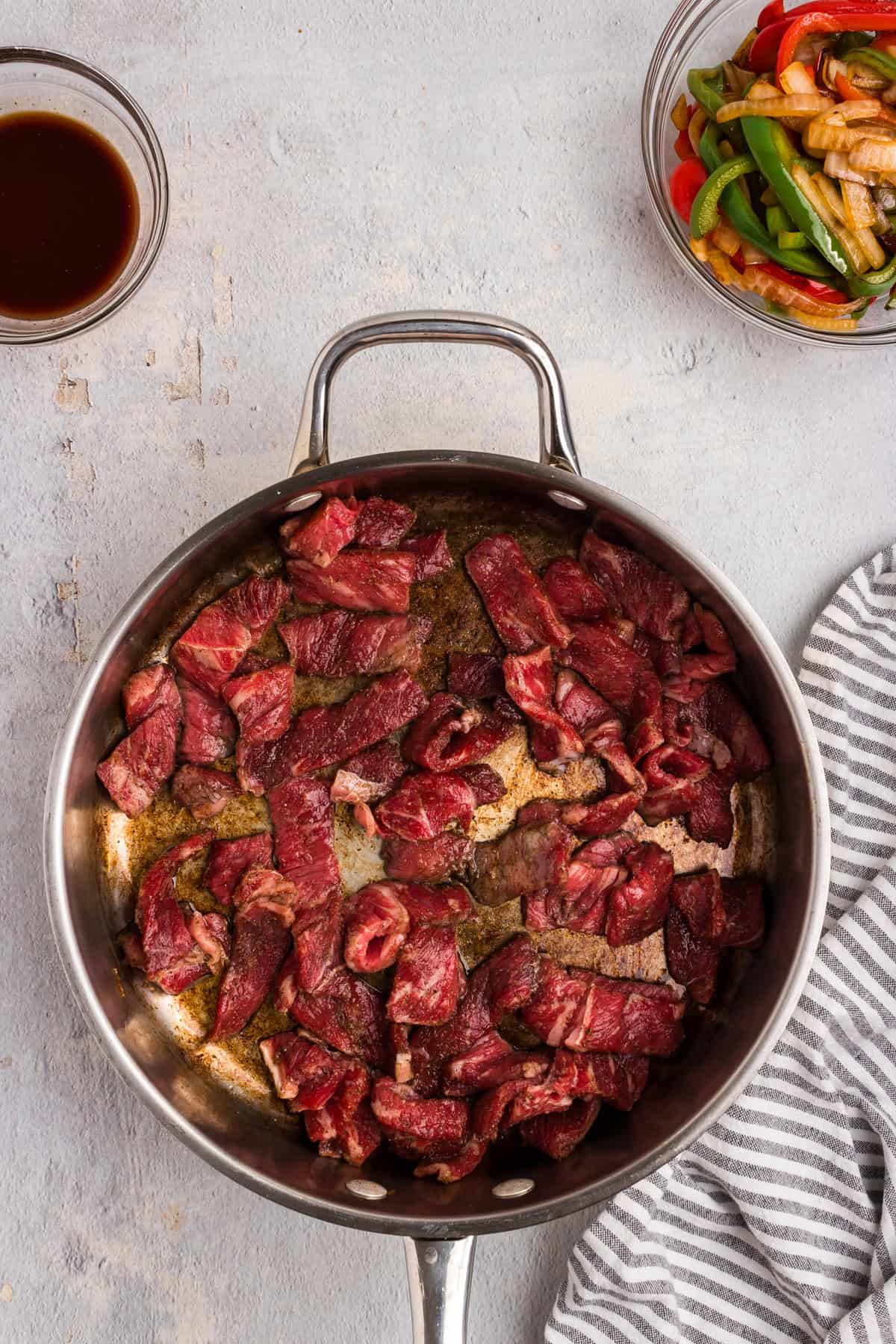 Overhead picture of raw steak in a pan.
