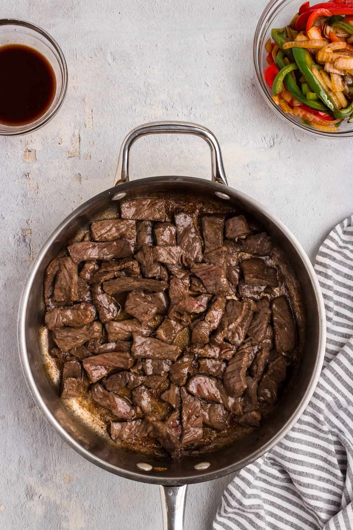 Overhead picture of cooked steak in a pan.