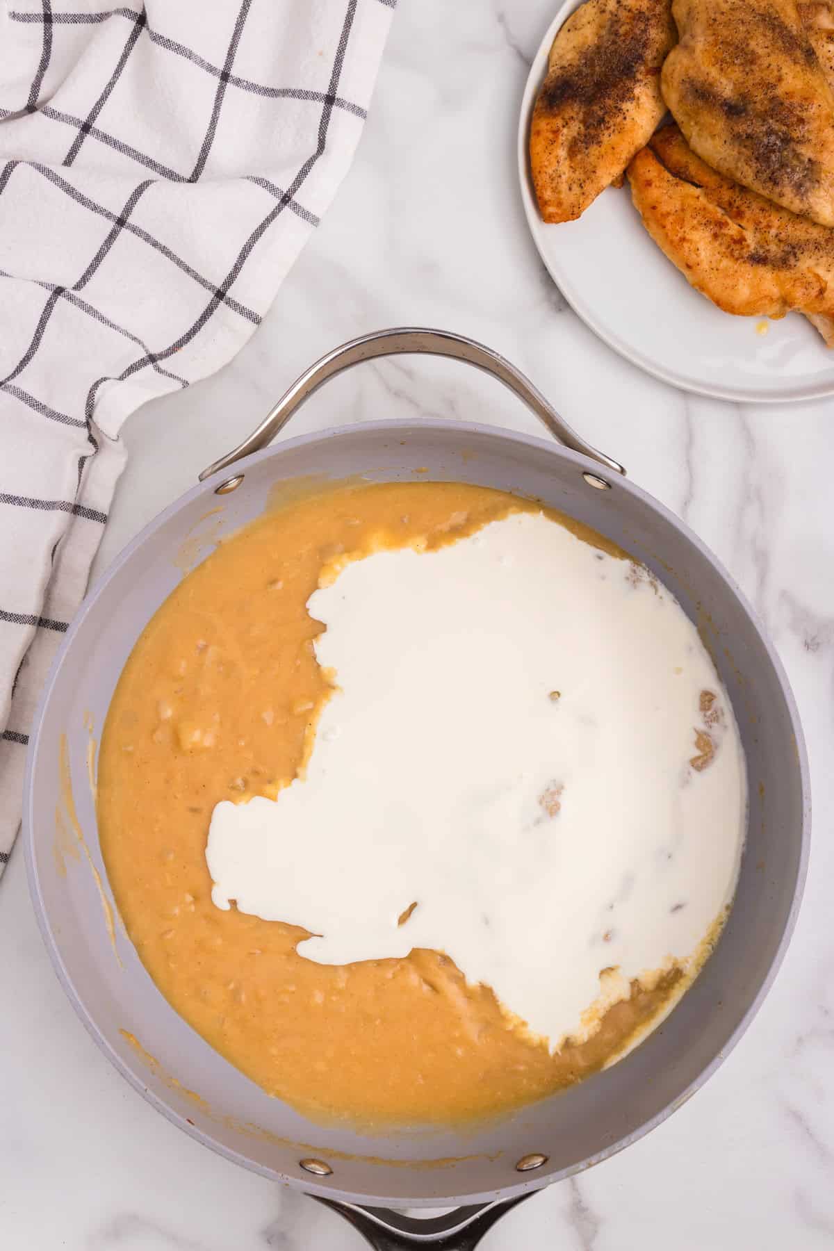 Overhead picture of unmixed ingredients in a frying pan.
