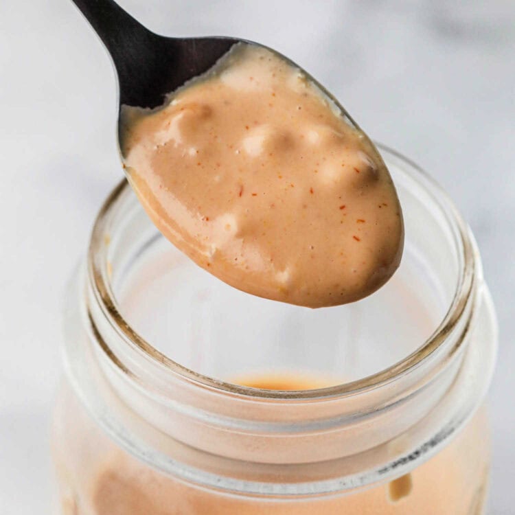 Spoon with homemade burger sauce on it