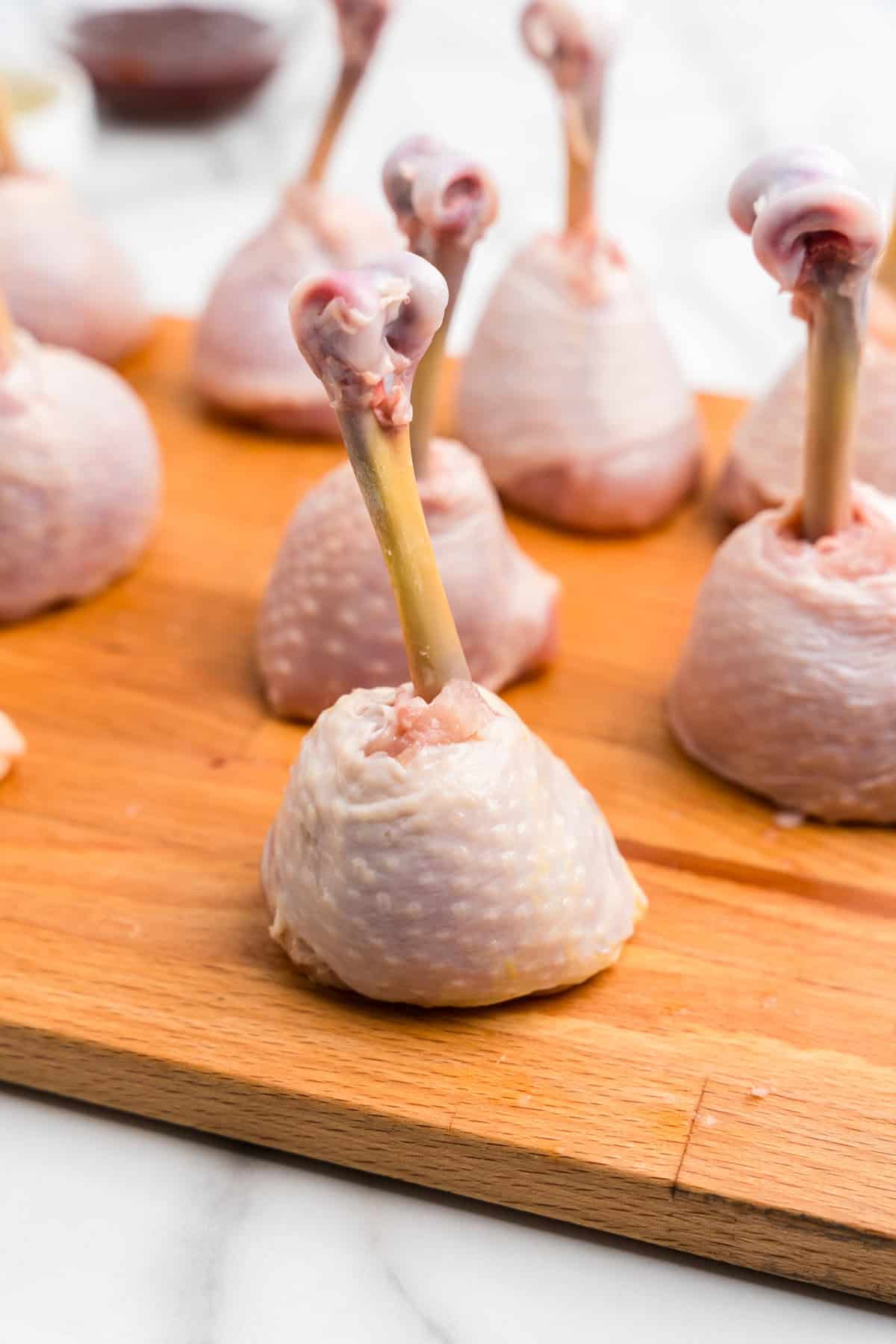 Chicken Lollipop Drumsticks on cutting board