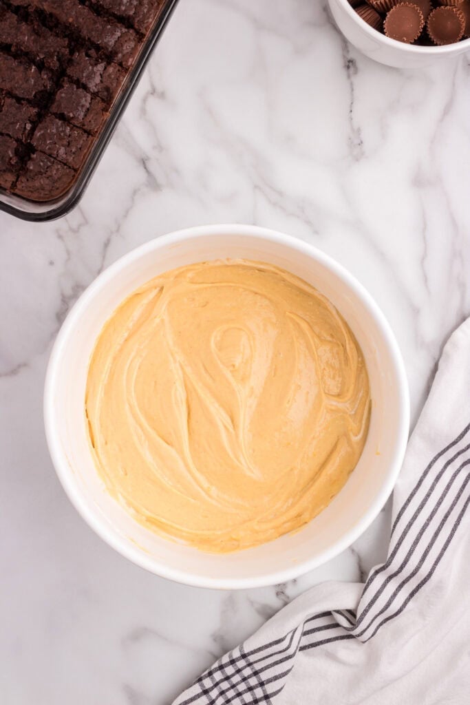 The completed peanut butter and whipped topping mixture, fully blended in a white mixing bowl.