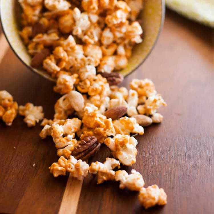 Butterscotch Popcorn in a paper cone falling out