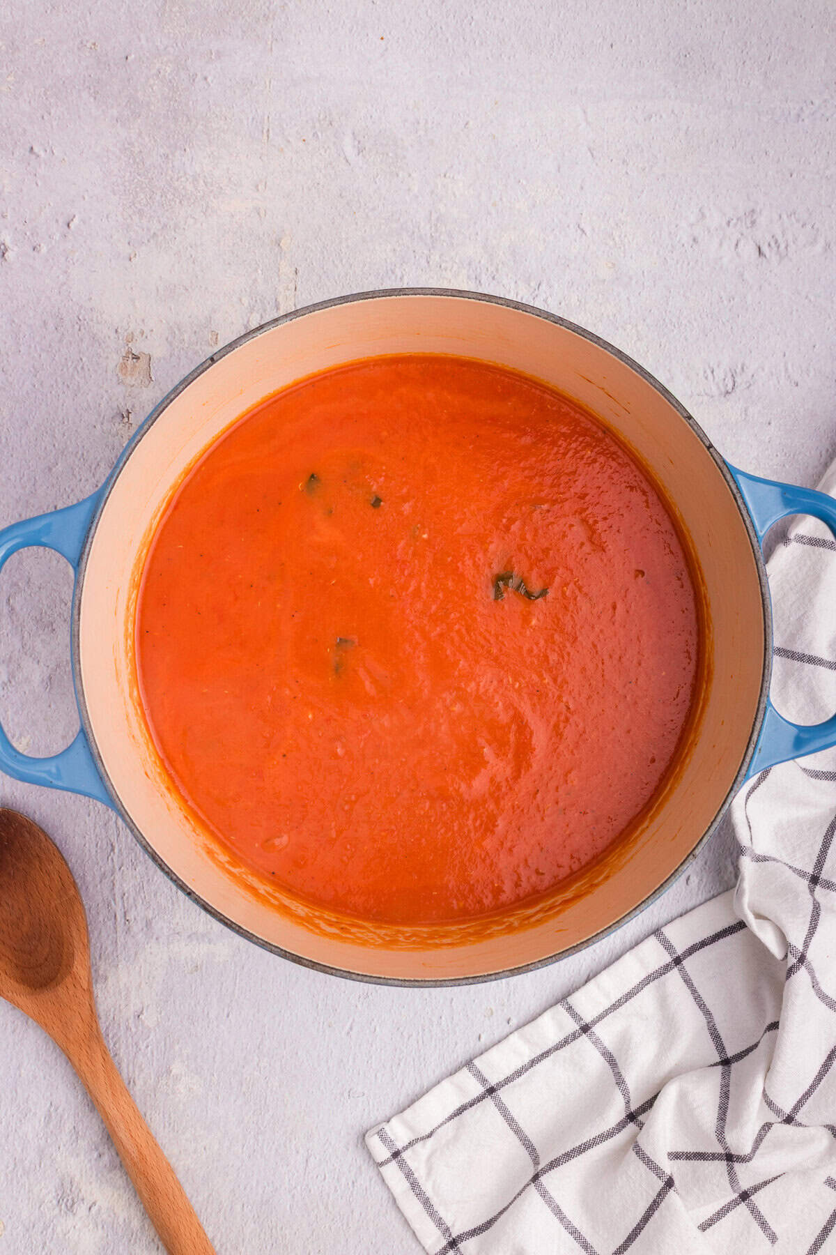 Tomato soup after being blended to a smooth, creamy consistency in the Dutch oven.