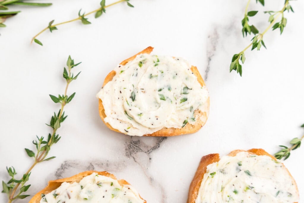 Herb Butter spread on 3 slices of bread